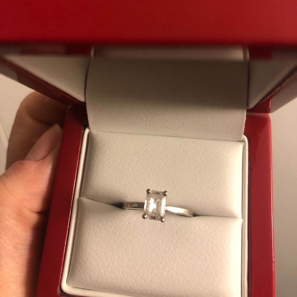Emerald solitaire engagement ring